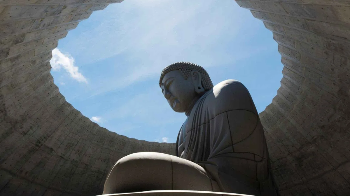 The head of the Tadao Ando Buddha above its lavender hill at Makomanai Takino, a stop on Hokkaido tours from Sapporo, Japan